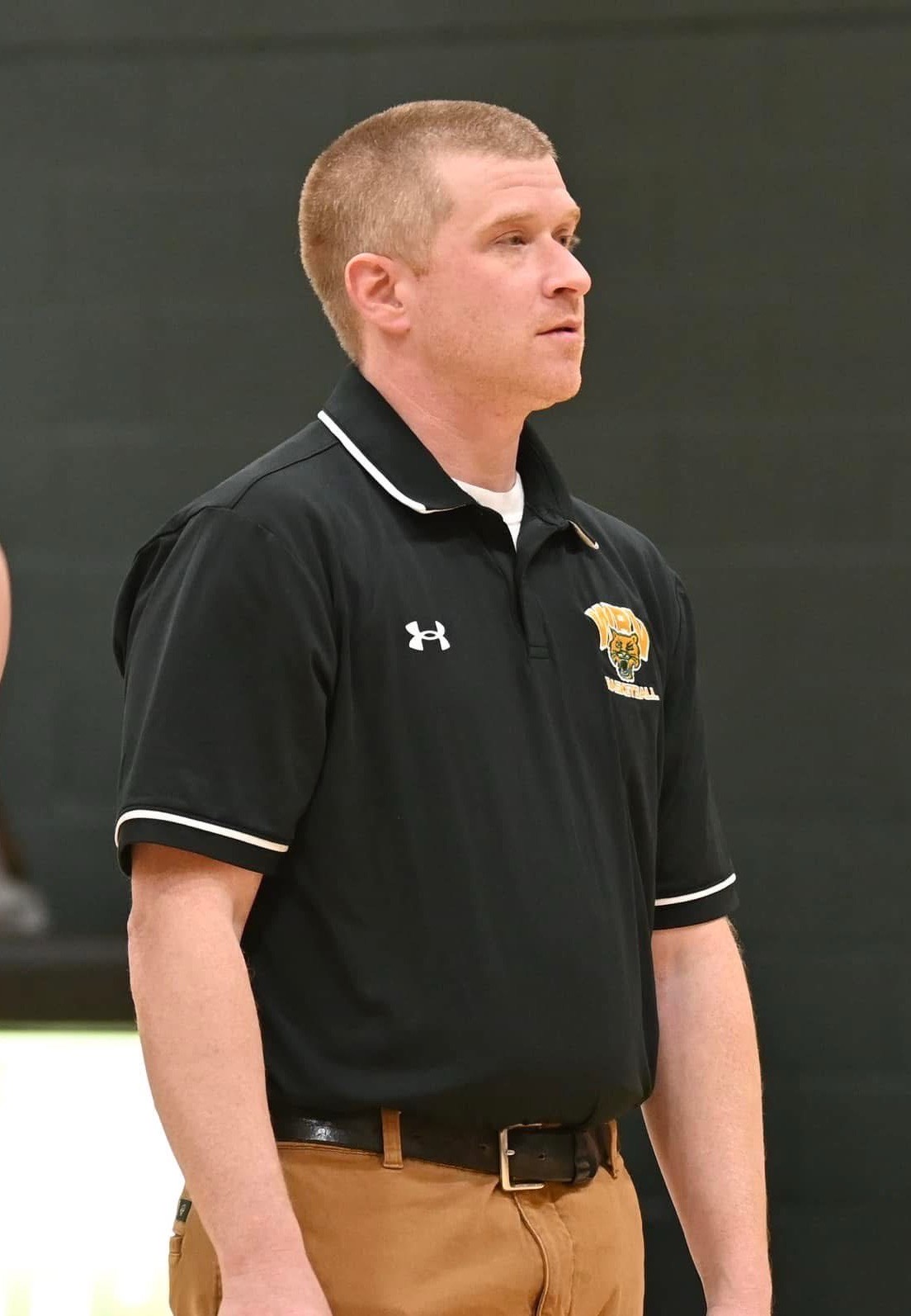 Man with short hair in black tshirt